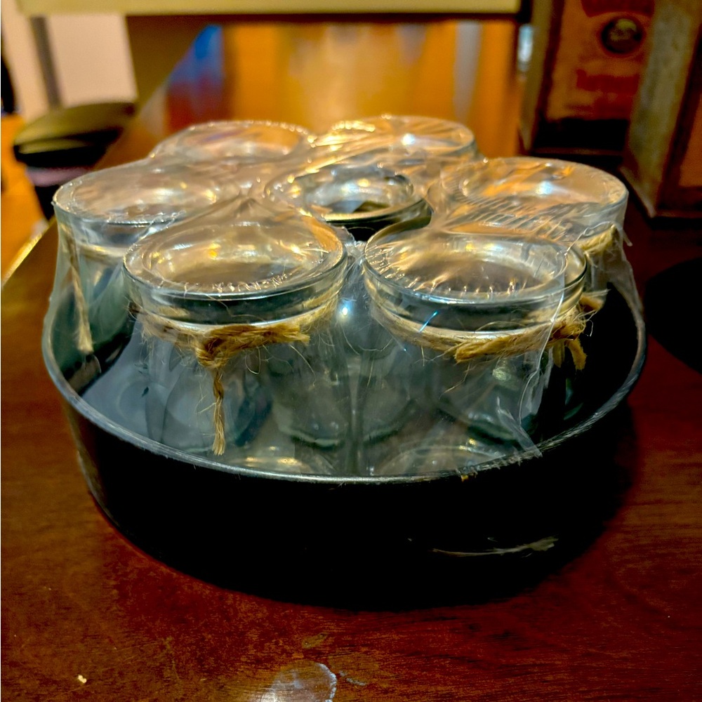 Set of seven glass jars with metallic tray